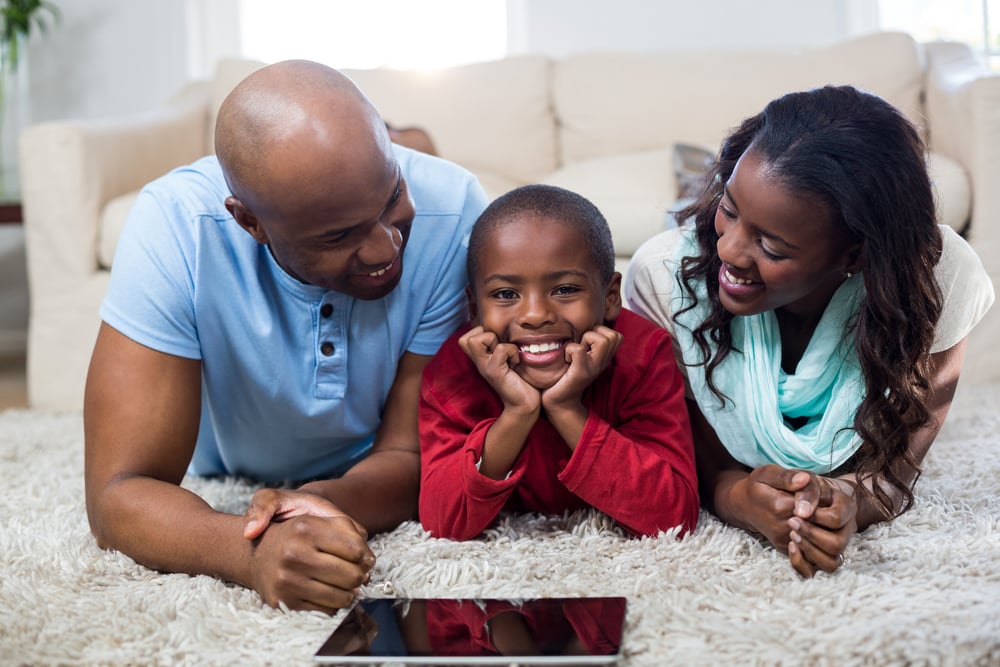 Family with digital tablet at home